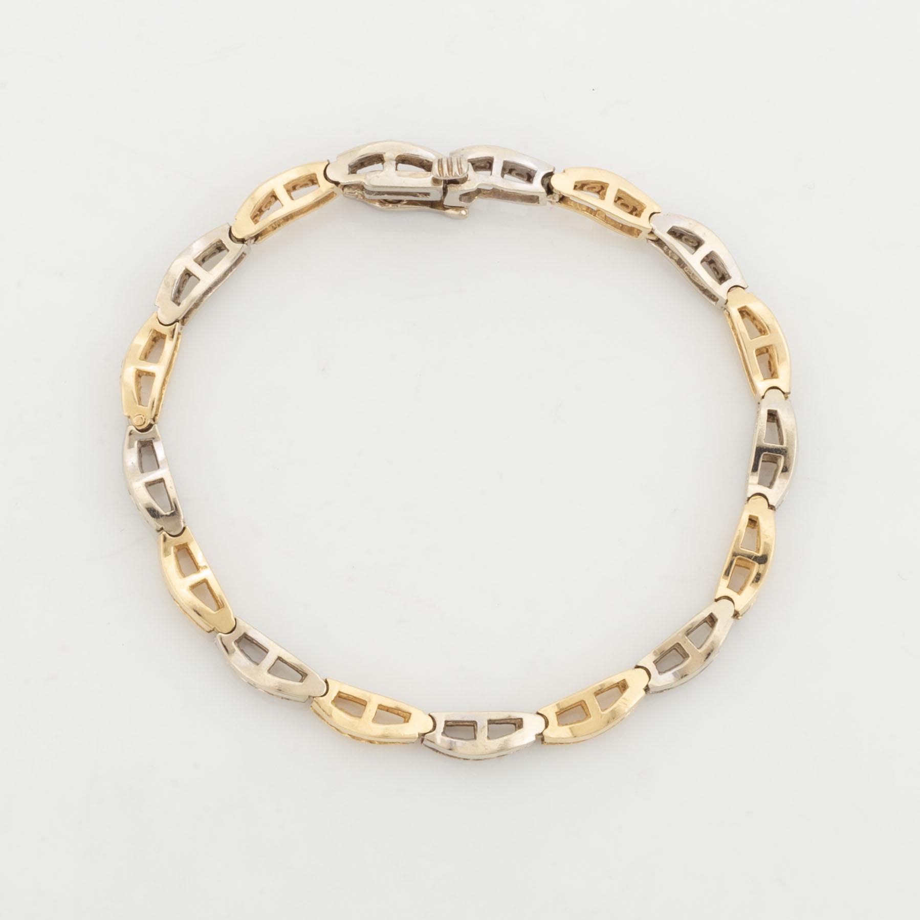 14K gold and brilliant cut diamond bracelet, with extra link.