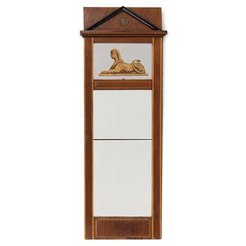 An Empire style mirror, second half of the 20th century.