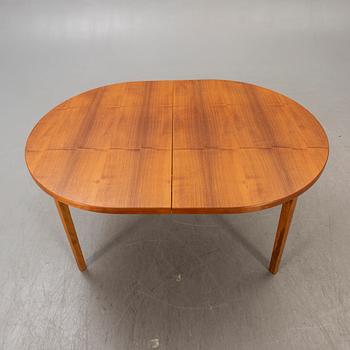 A 1960s teak dining table.