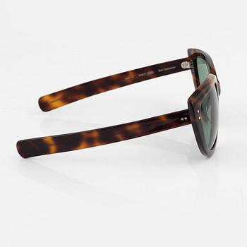 Oliver Goldsmith, a pair of  "Y-not" sunglasses.