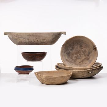 Seven folk art bowls and a trough, 19th century.