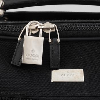 Gucci, suitcase/cabin bag.