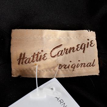 A black velvet evening jacket with pearls by Carnegie.