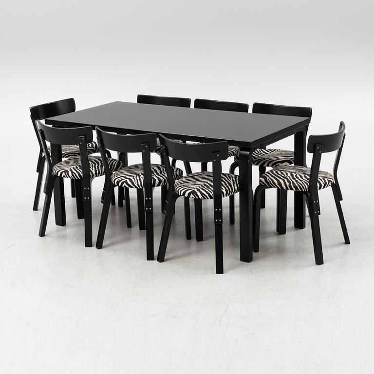 Alvar Aalto, a dining table and eight chairs, model 69, Artek, Finland, end of the 20th century.