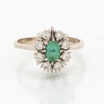 Ring in 18K white gold with an oval faceted green tourmaline and round brilliant-cut diamonds.