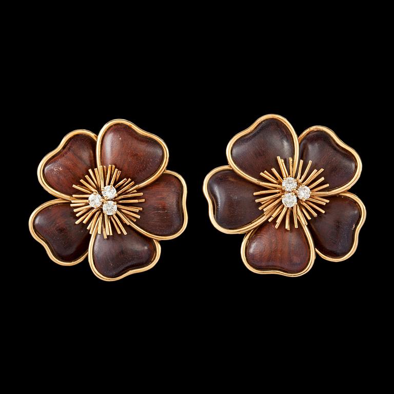 A pair of Van Cleef & Arpels ebenholtz and brilliant cut diamond flower earrings, tot. app. 0.50 cts. c. 1970's.