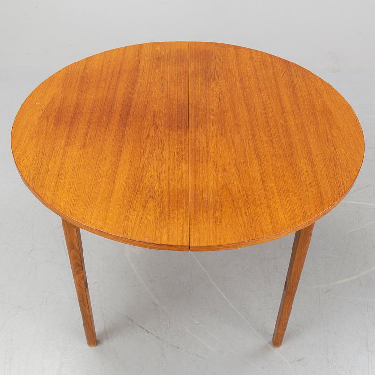 A teak veneered table, second half of the 20th century.