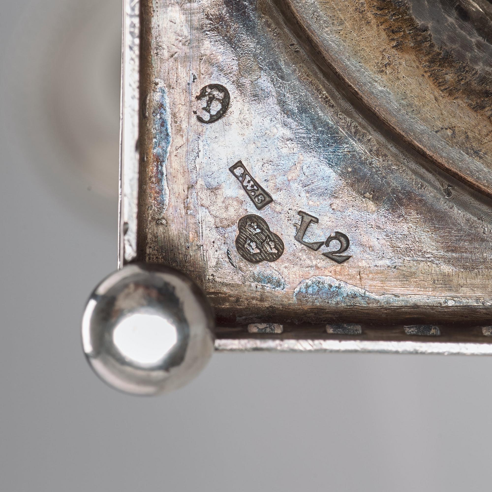A pair of Swedish 18th century silver candlesticks, Stephan Westerstråhle, Stockholm 1793, one nozzle J E Torsk 1895.