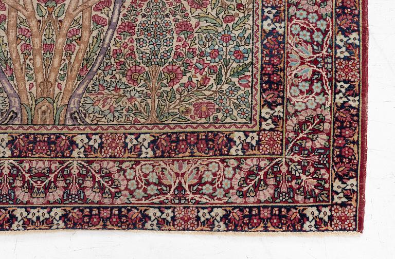 An antique Kirman rug, south Persia, c. 220 x 140 cm.