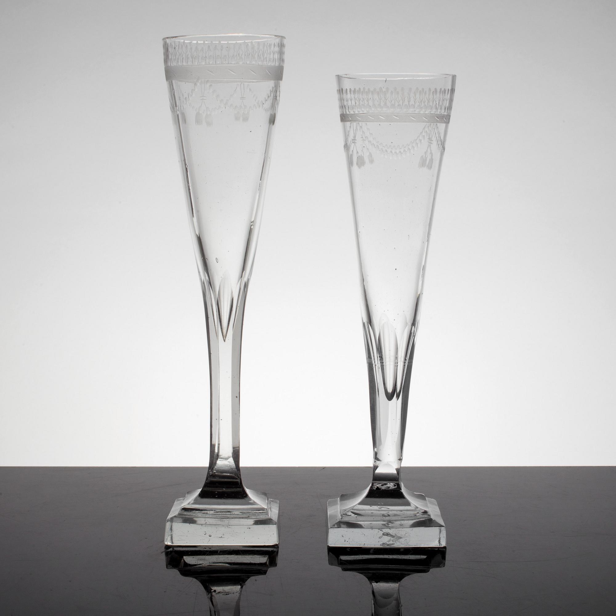 A set of 8 early 19th century champagne glasses.