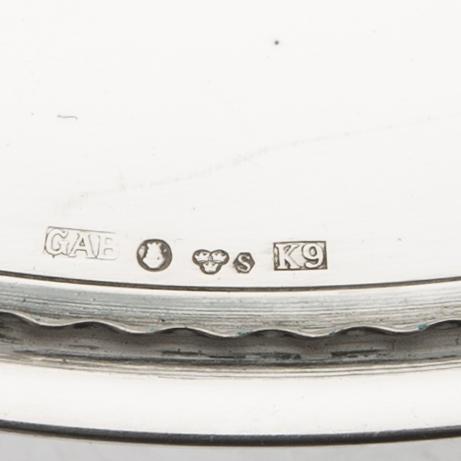 A set of 12 silver plates mark of GAB Stockholm 1963, total weight 6000 grams.