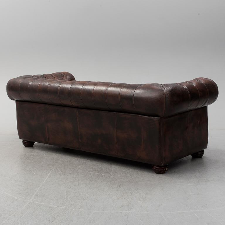 A 20th century leather upholstered Chesterfield sofa by Rubelli.
