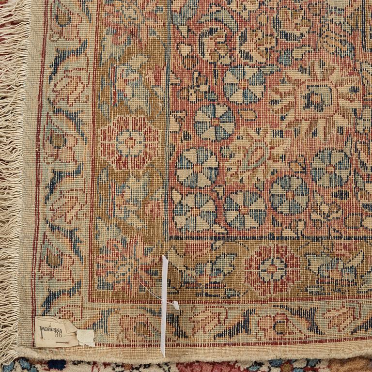 A semi-antique/old Kerman carpet, around 361 x 264 cm.