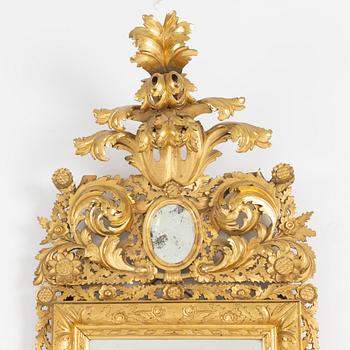 A 20th century Baroque style mirror.