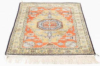 A rug, silk Quum, ca 121 x 76 cm.