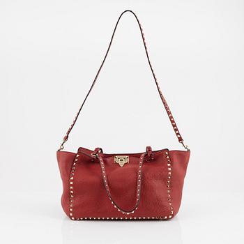 Valentino Gravani, a red leather studded tote bag, 2018.