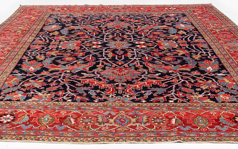 An antique Heriz Serapi, north west Persia, ca 421 x 352 cm.