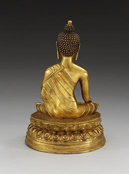 A gilt bonze sinotibethan figure of a seated Buddha, 19th Century.