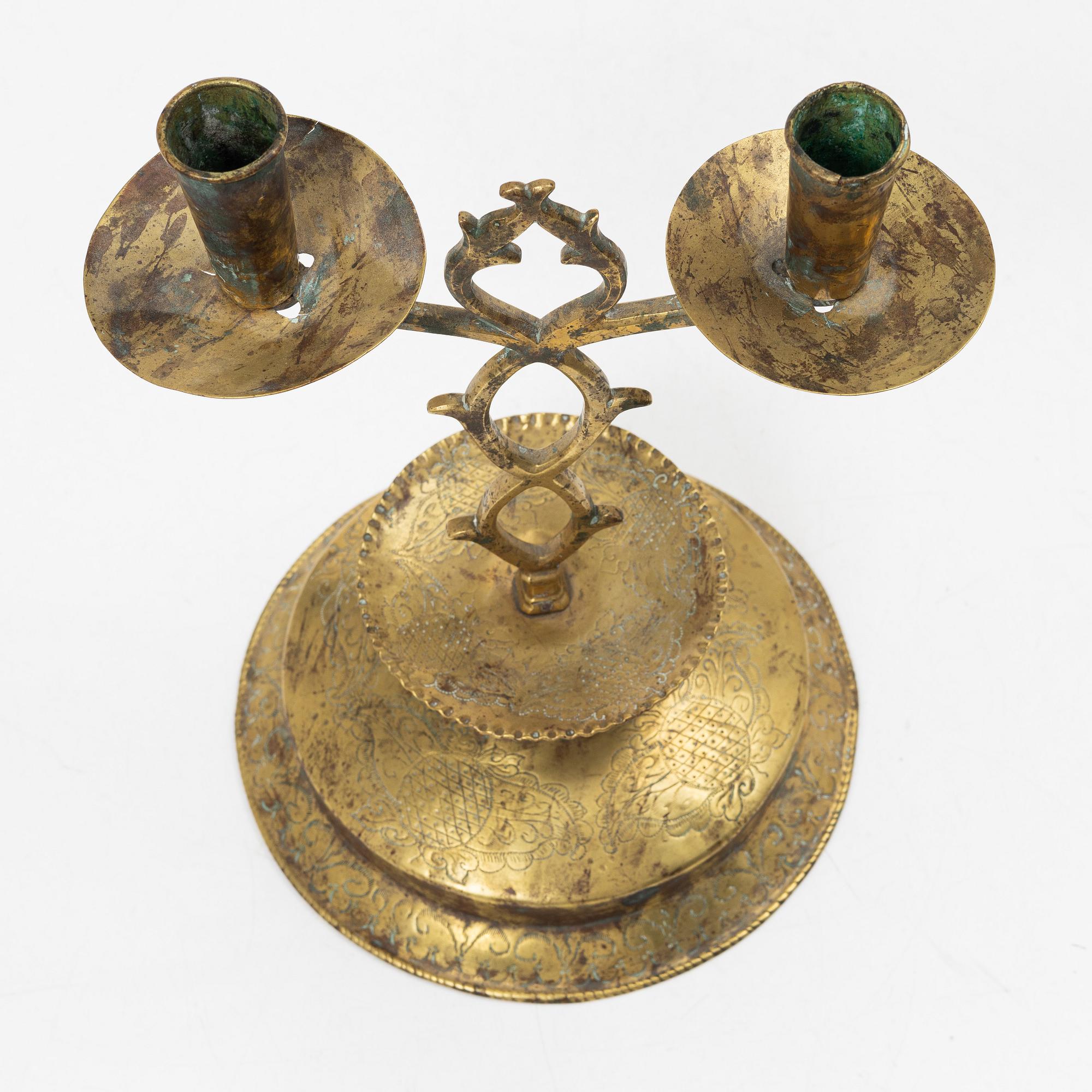 A Swedish brass two-branch candlestick, 18th/first part 19th century.