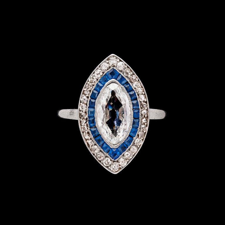 RING, navettslipad diamant, ca 1.20 ct, blå safirer och briljantslipade diamanter.
