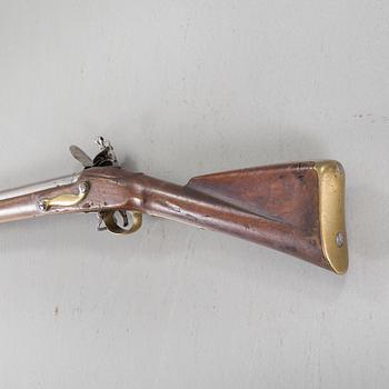 A flintlock rifle from Tower, England, around the year 1800.