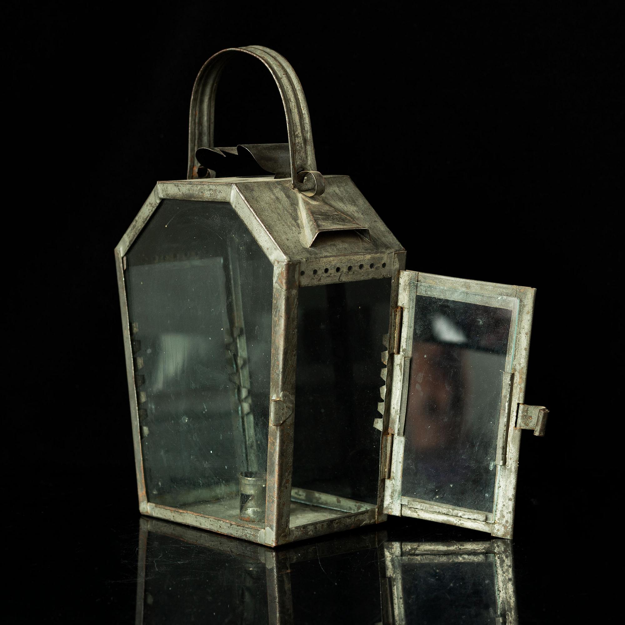 An 18th century tinplate lantern.