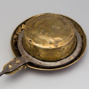 An 18th century brass bed warmer.