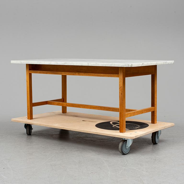 JOSEF FRANK, a model 2125 marble top coffee table from Svenskt Tenn.