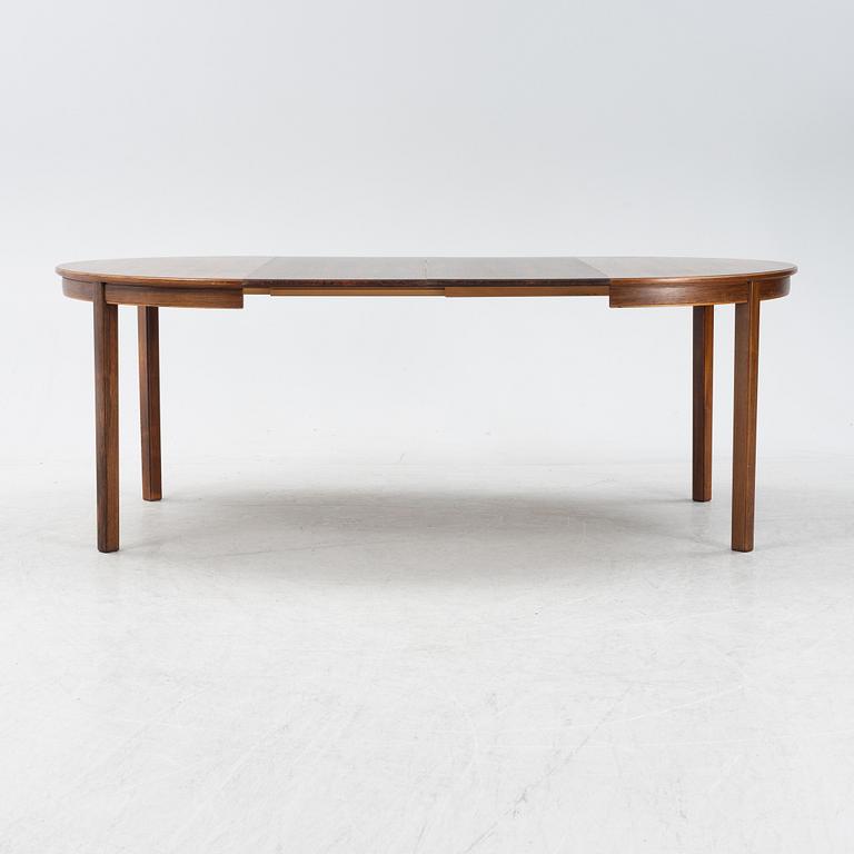 A 1960's/70's rosewood veneered dining group.