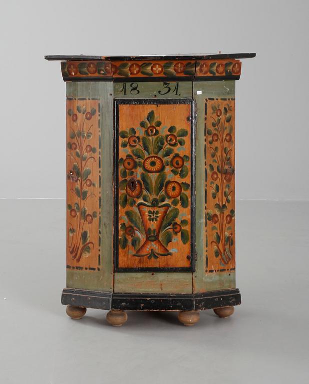 A Swedish wall cabinet dated 1831.