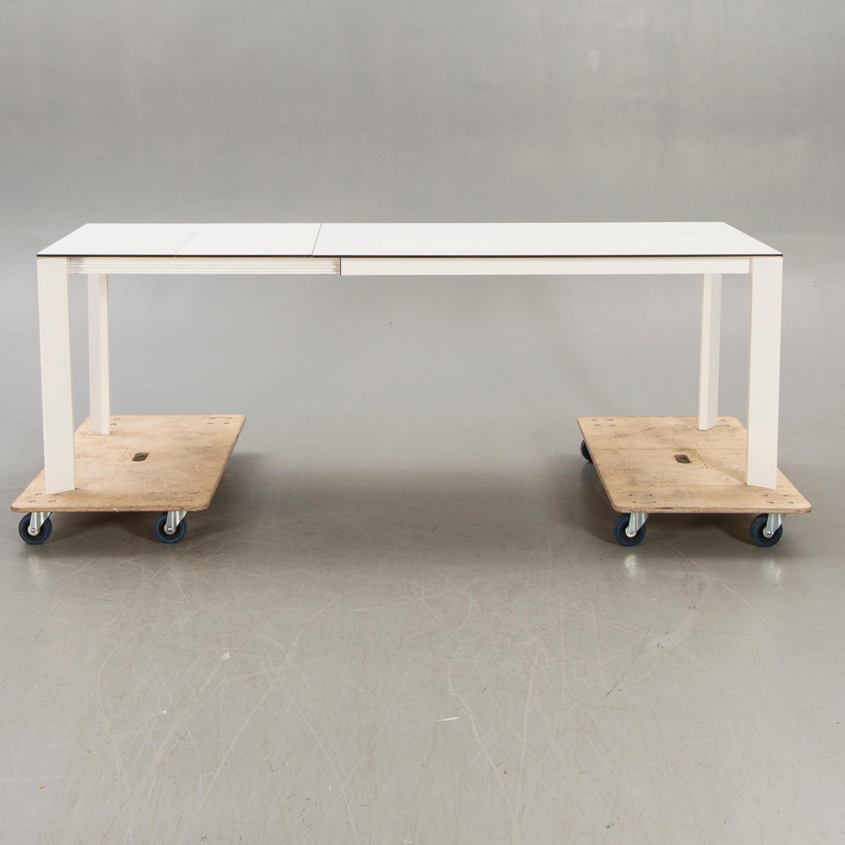 Caronni & Bonanomi, a "Every + Grid" dining table for Desalto 21st century.