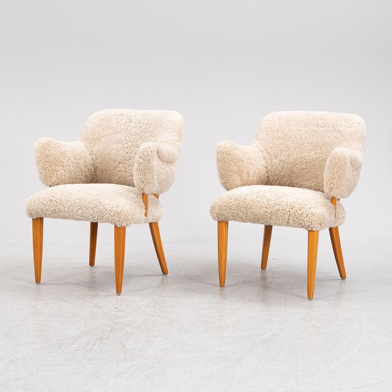 A pair of 'Lilla Sällskapet' armchairs by Carl Malmsten, second half of the 20th Century.