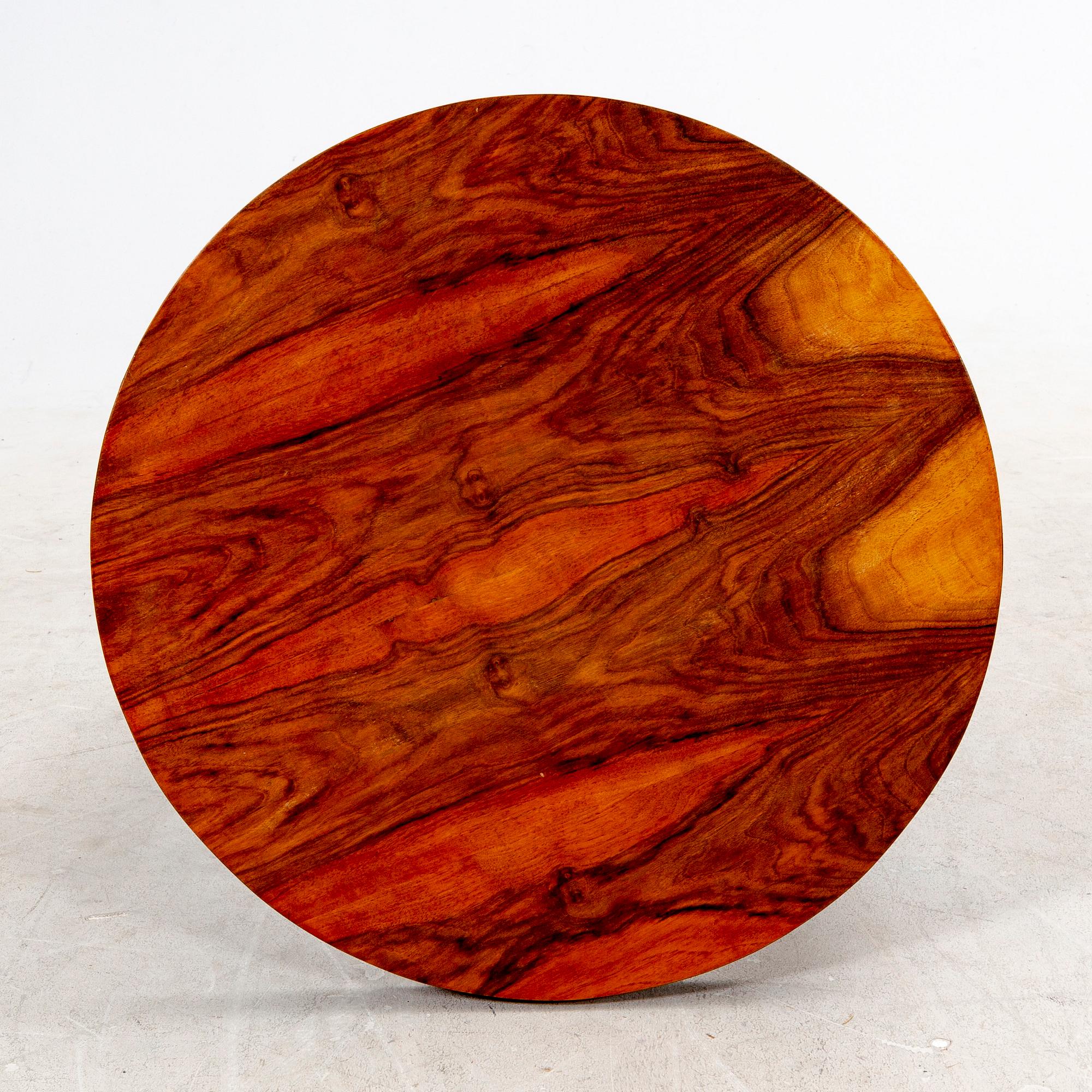 A veneered table from the first half of the 20th century.