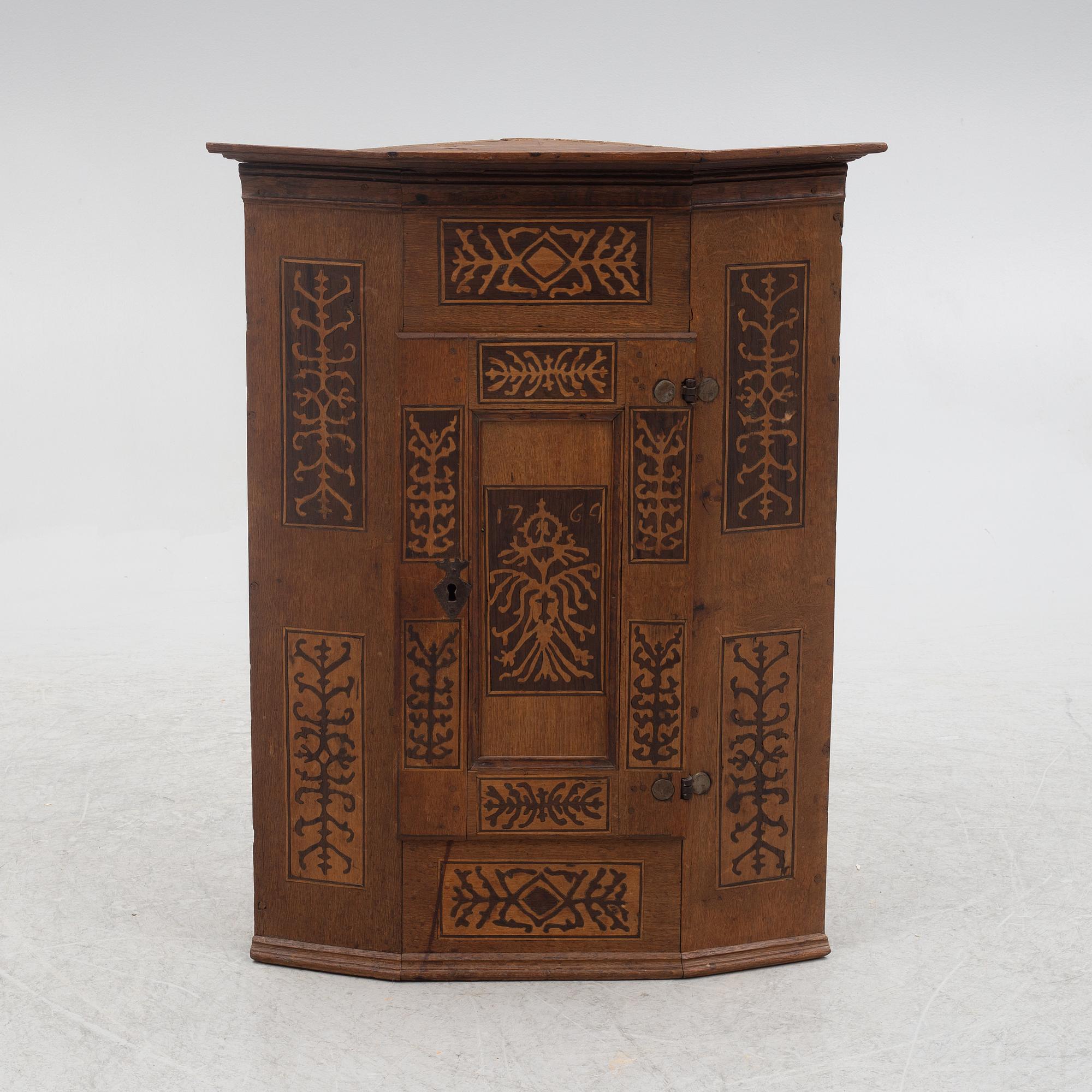 Corner cabinet, dated 1769.