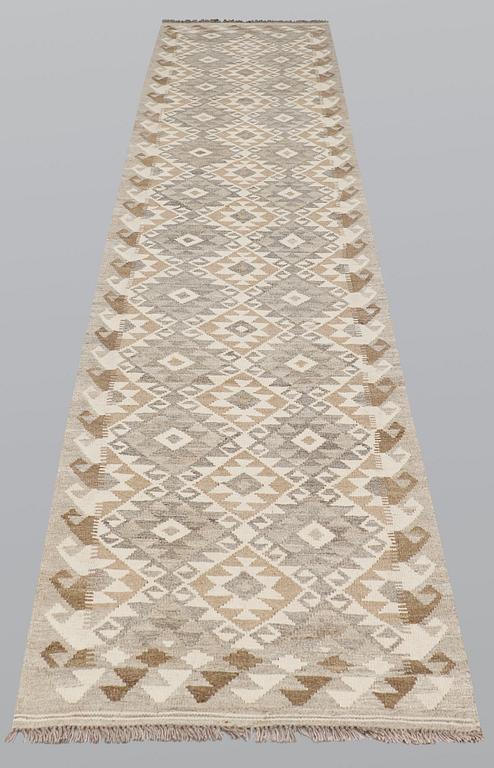 A runner, kilim, ca 387 x 79 cm.
