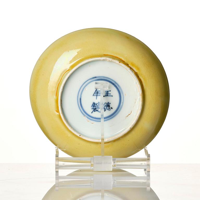 A yellow glazed dish, Ming dynasty with Zhengde mark.