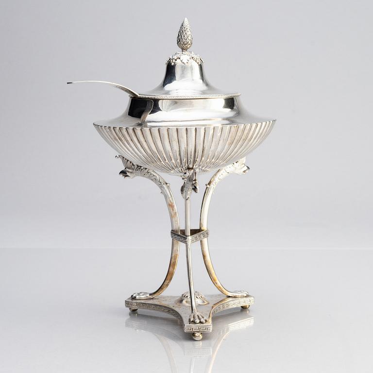 A Swedish Empire silver sugar bowl with lid and a suger sprinkle spoon, marks of Adolf Zethelius, Stockholm 1819.