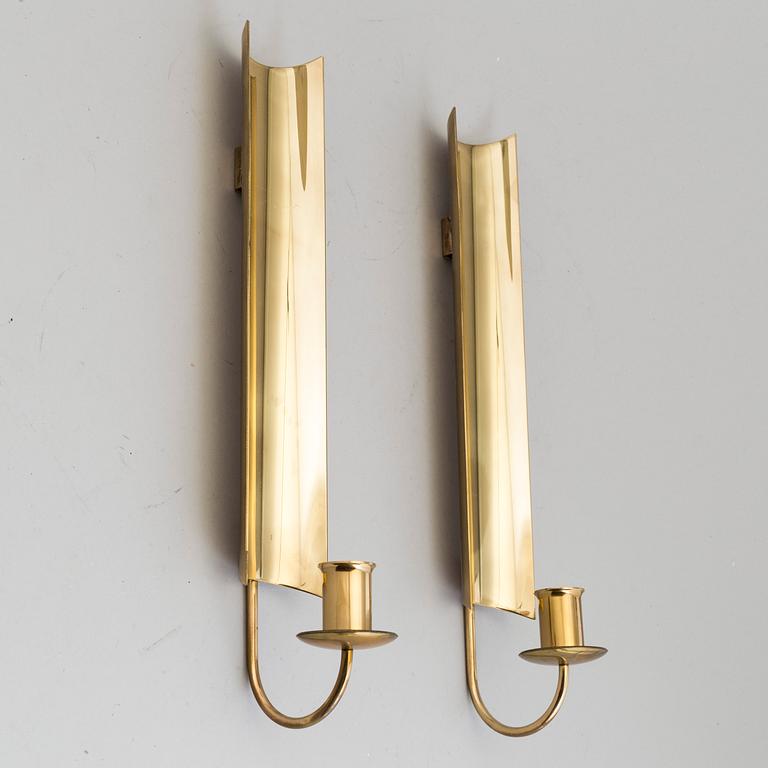 a pair of Pierre Forssell brass wall sconces, Skultuna.