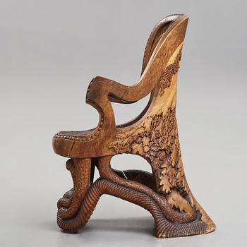 Knut Fjaestad, an Art Nouveau sculptured and carved pine throne, Sweden early 20th century.