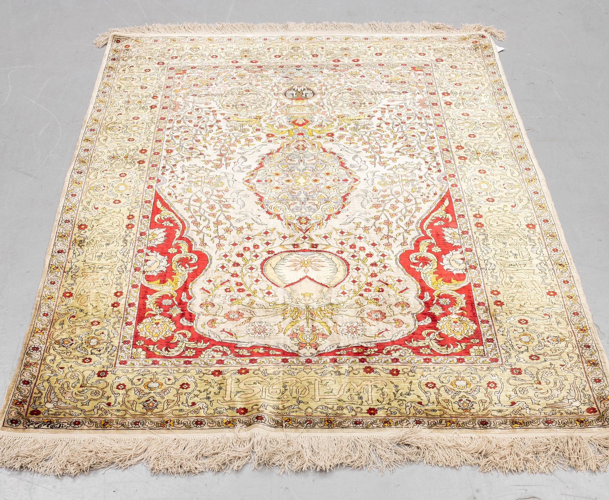 A rug, Old silk Hereke, ca 178 x 119 cm.