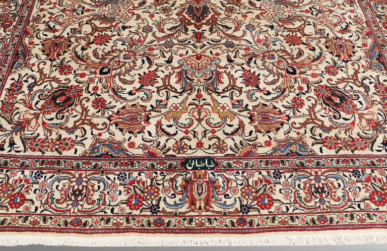 A CARPET, Tabriz, signed, ca 338 x 254 cm.