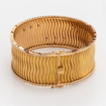 Rannekoru, 18K kultaa, safiireja, samragdi ja timantteja n. 0.075 ct yht. Tuontileimattu Koruteollisuus Tillander 1962.