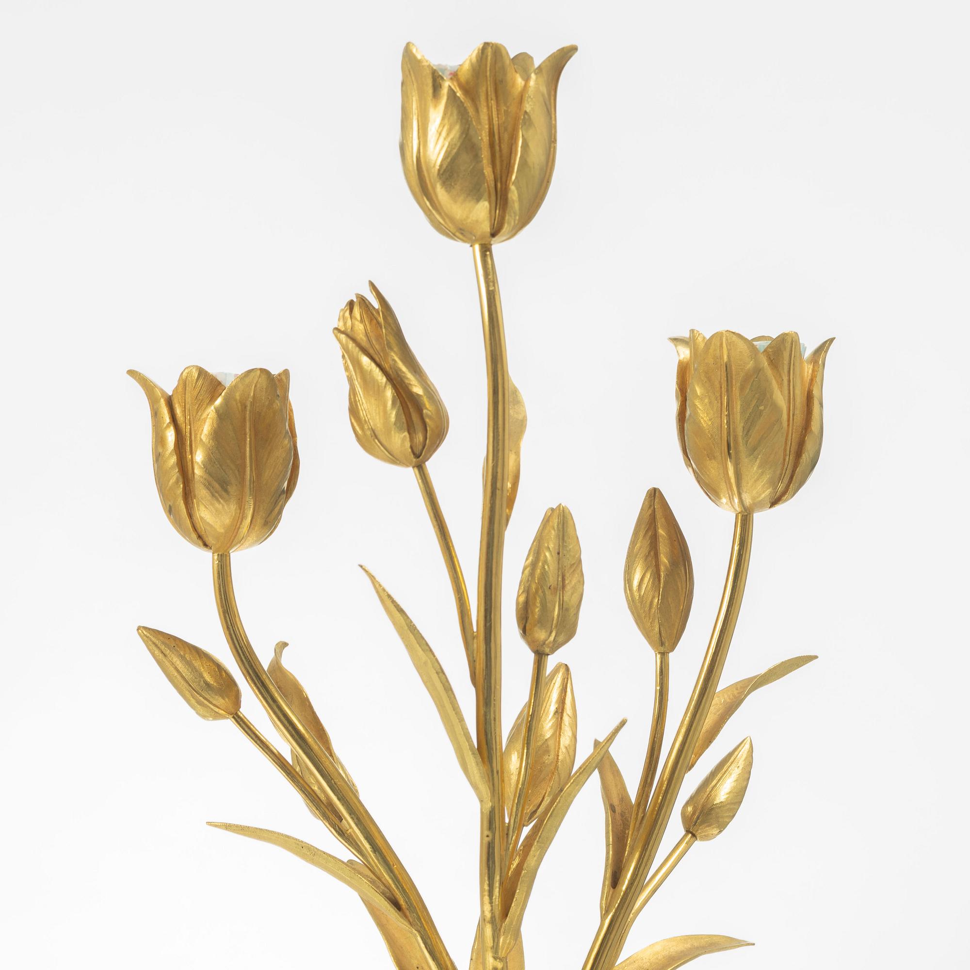 A pair of three light porcelain and gilt bronze three-branch Louis XV-style candelabra, mid 19th century.