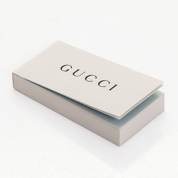 Gucci, sormus, "GG Running Charm", 18K valkokultaa ja timantteja.