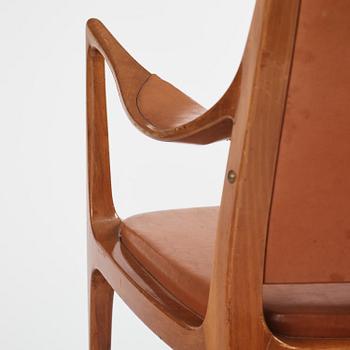 Hans Asplund, a walnut and leather easy chair, Nordiska Kompaniet, ca 1955, for the Nordiska Kompaniet beauty salon.