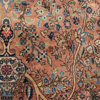 An oriental rug, circa 245 x 136 cm.