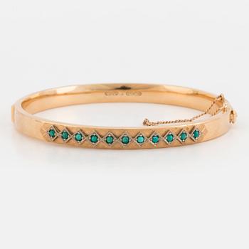 ARMRING med cabochonslipade turkoser.