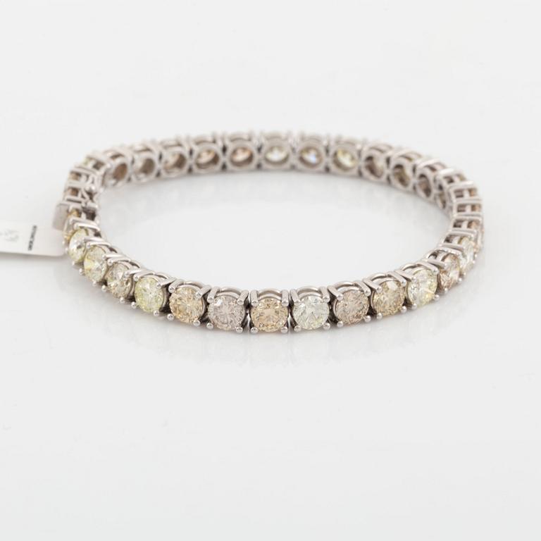 Round brilliant-cut diamond rivière bracelet, with IGI report.