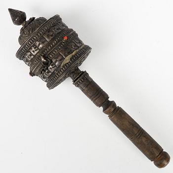 A Tibetian prayer wheel and three bronze opium weights, probably Burma.