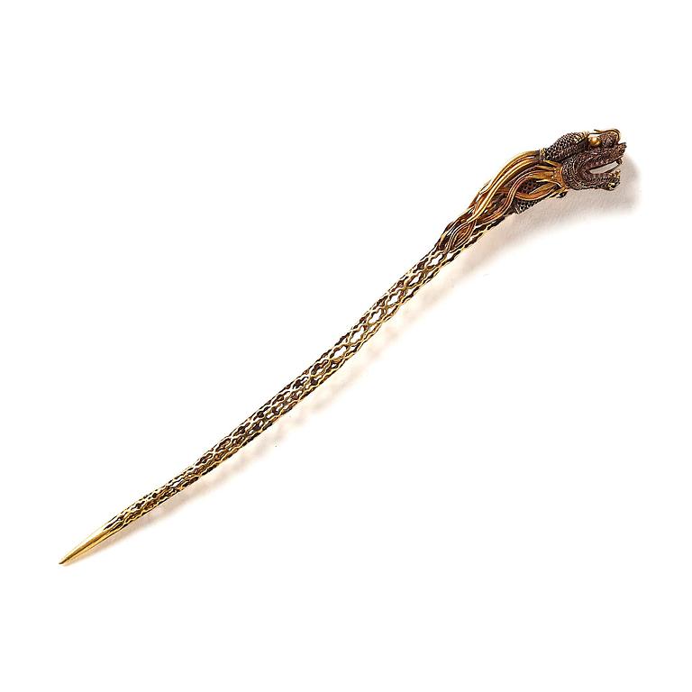 An elegant gold dragon shaped hair pin, Qing dynasty, Qianlong (1736-95).